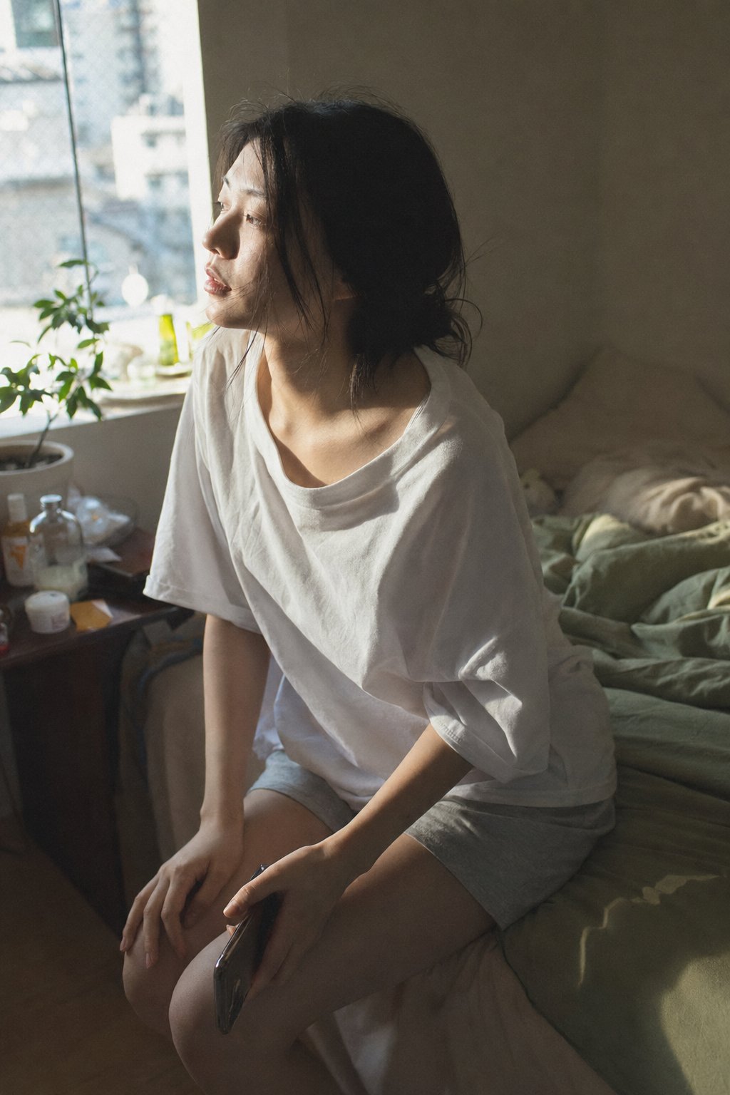 AI image generated from the “A close-medium shot of a young Japanese woman in her bedroom” prompt