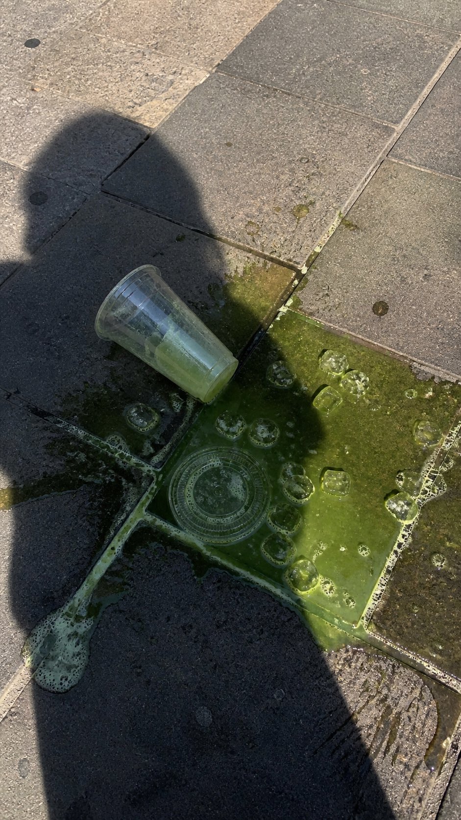 AI image generated from the “A realistic vertical smartphone photo of a spilled green iced” prompt