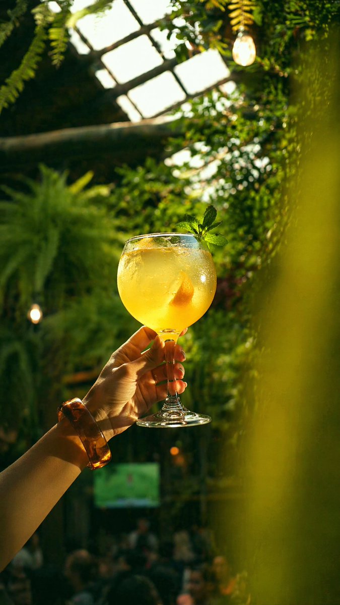 AI image generated from the “Golden Cocktail in Greenhouse Bar” prompt